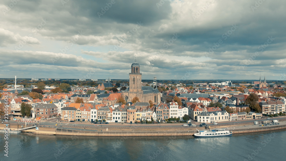Aerial panoramic view of the Dutch medieval city of Deventer in The Netherlands seen from the other side of the river IJssel that passes it