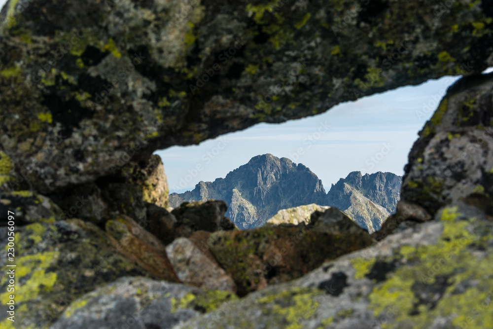 A view of the peak through a rocky window.