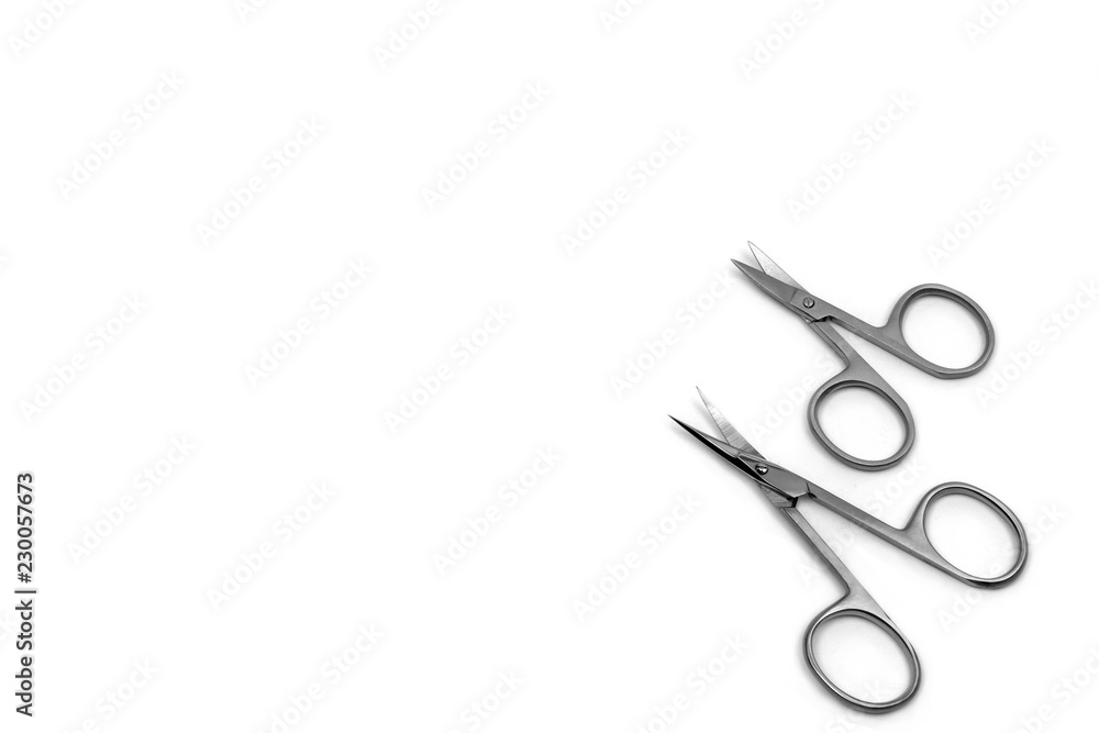 Nail Clippers for nail and cuticle care. Scissors of different size on white background.