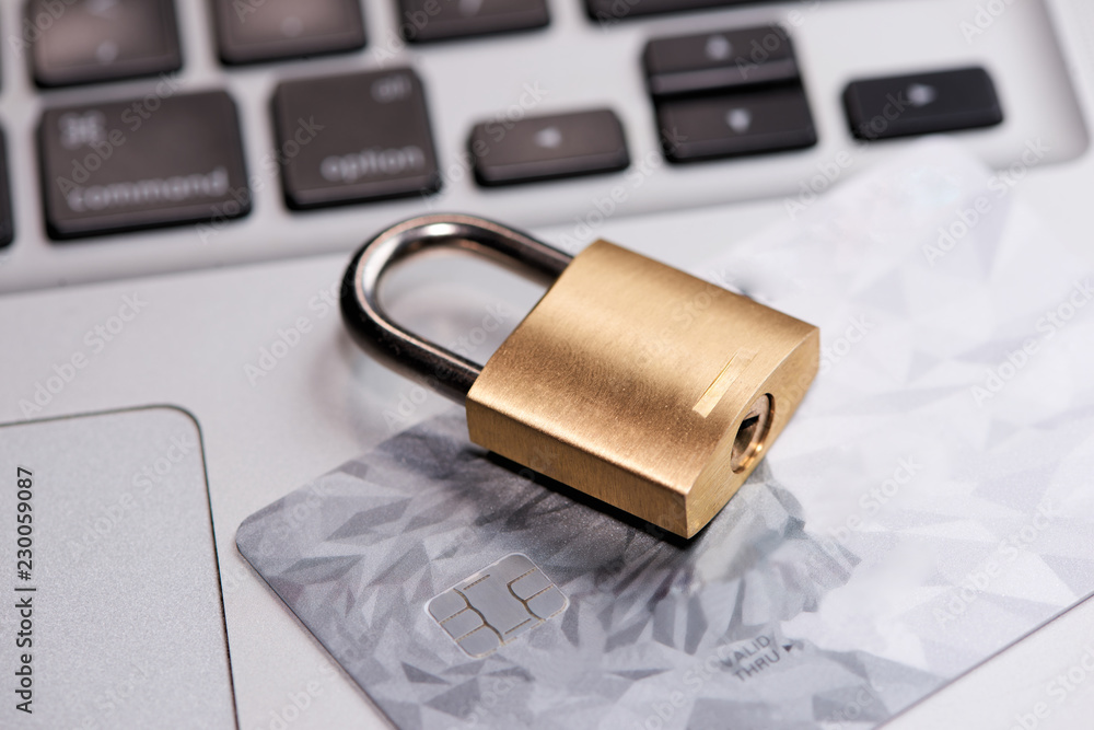 Credit cards on the keyboard with lock close up Credit cards on the keyboard with lock close up