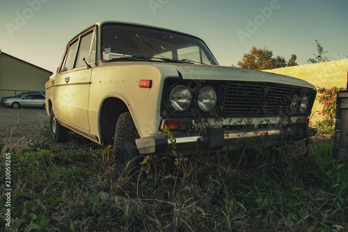 Old broken overgrown Soviet car
