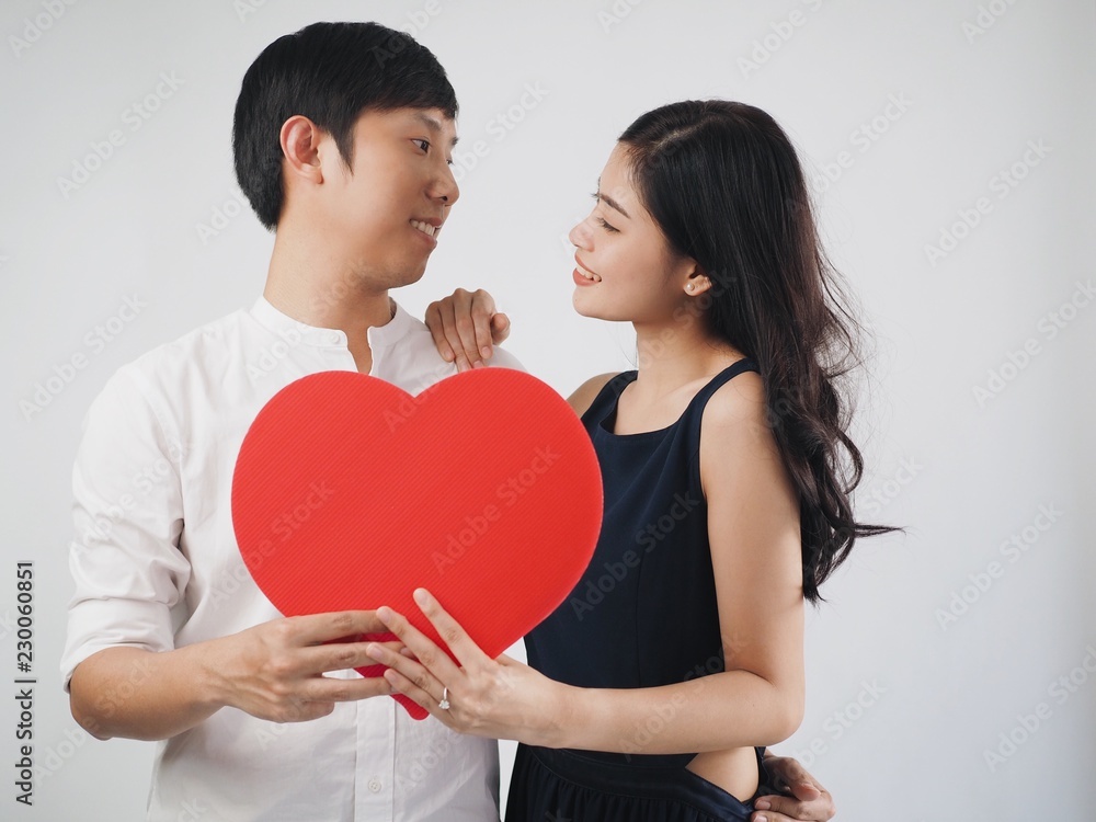 young couple with red heart