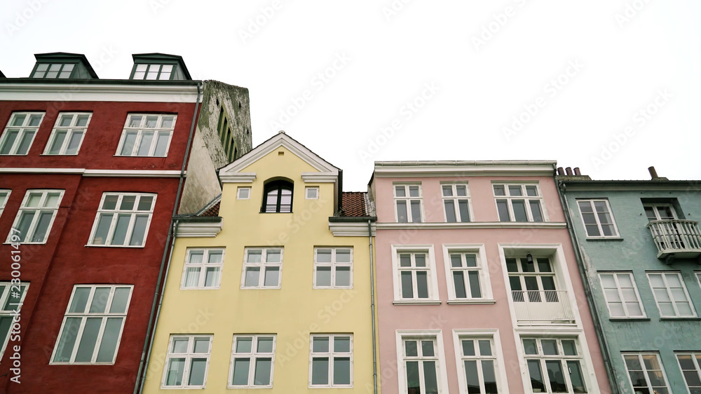 Colourful facade of the old houses, Nyhavn, Copenhagen, Denmark. Canal and entertainment district tourist attraction in Copenhagen.