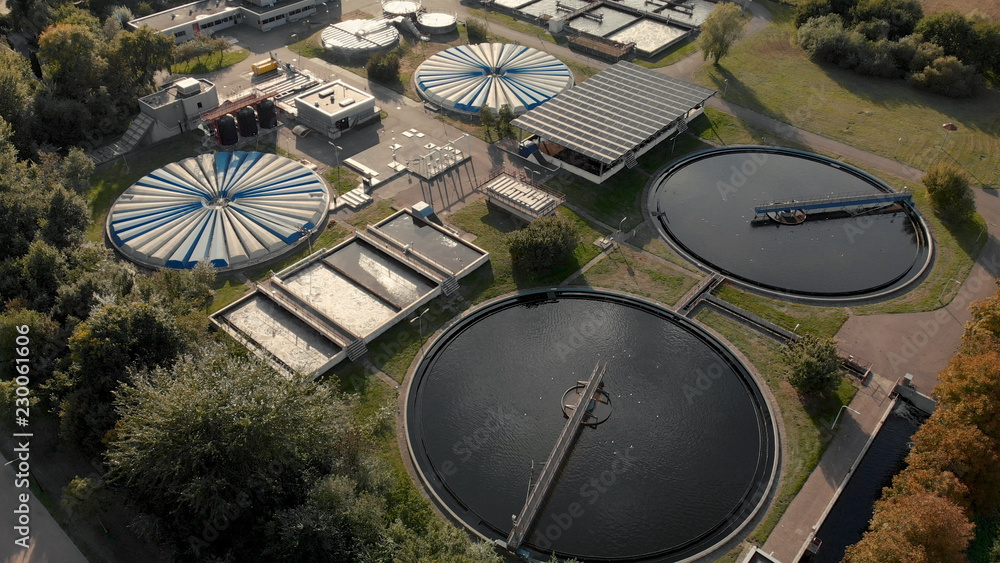 Water treatment facility in The Netherlands seen from above with various water tanks and adjacent buildings