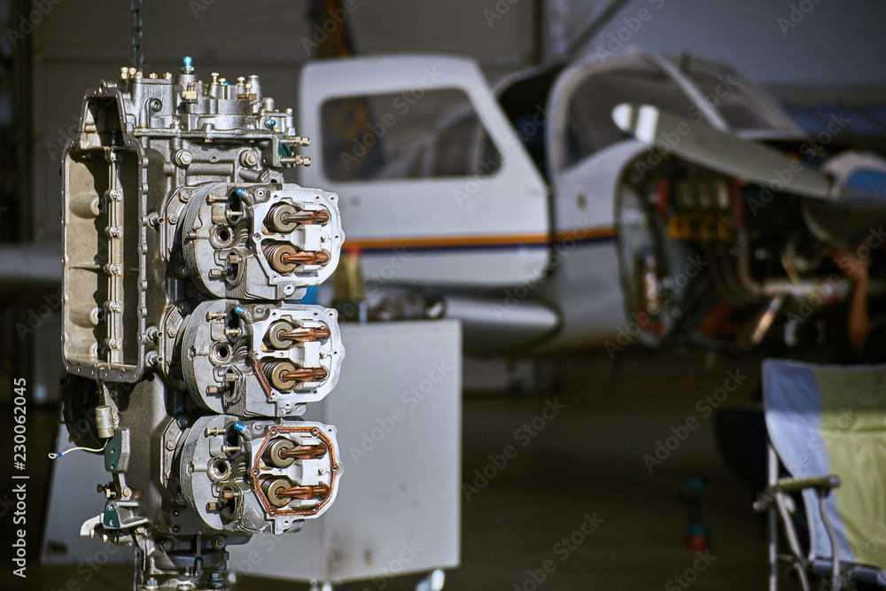 Removal and repair of an airplane engine by a service worker. Removal and repair of an airplane engine by a service worker.