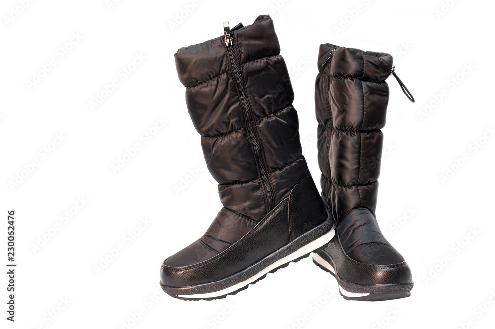 High black winter boots for a girl or woman on a white background are isolated