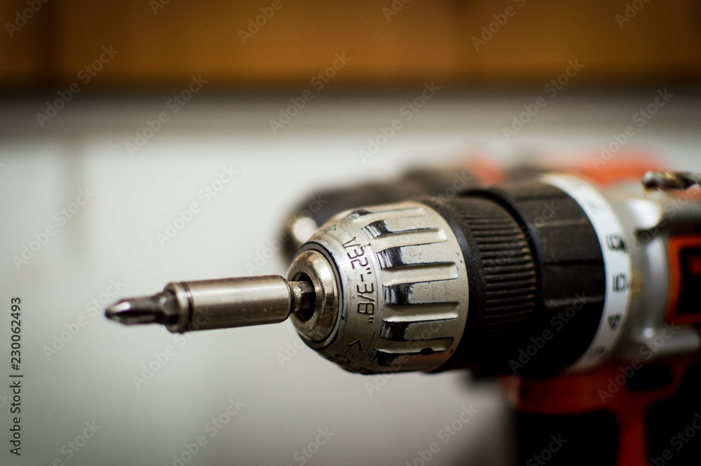 Battery Drill Set orange and black seen close up blurred background