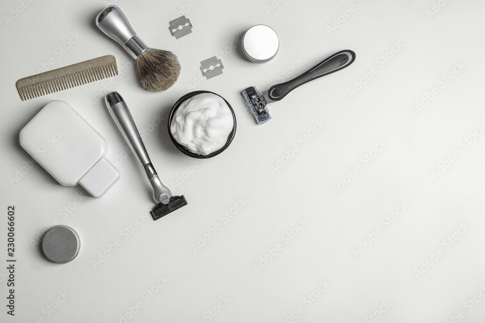Flat lay composition with men's shaving accessories and space for text on white background Flat lay composition with men's shaving accessories and space for text on white background