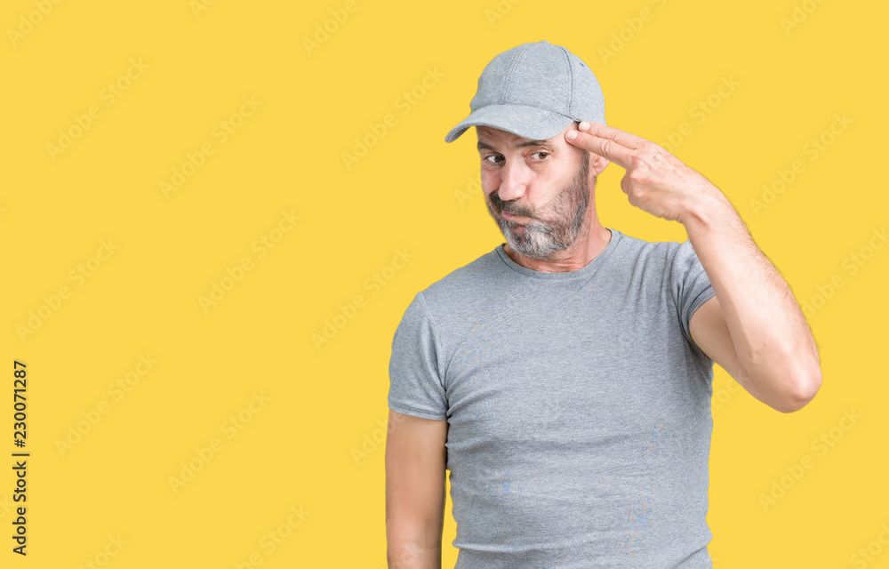Handsome middle age hoary senior man wearing sport cap over isolated background Shooting and killing oneself pointing hand and fingers to head, suicide gesture. Handsome middle age hoary senior man wearing sport cap over isolated background Shooting and killing oneself pointing hand and fingers to head, suicide gesture.