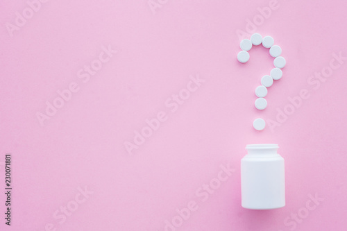 Close up of pills. Dietary supplements. Variety pills. Vitamin capsules on pink background