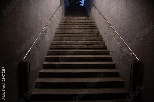 Stairs. subway staircase old in dark night secluded, concrete stairs in the city, stone granite stair steps often seen on monuments and landmarks, going up. Architectural details interiors 