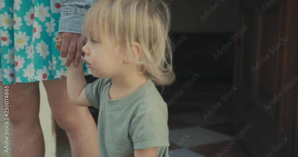 Little toddler finding a coin in the street Little toddler finding a coin in the street