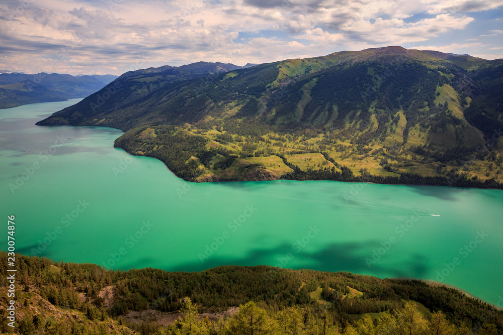 Kanas Lake, Kanas Nature Reserve. Jinqiu Xinjiang Province, China. Alpine forest and fresh glacier water. Altai Mountains, Kazakhstan, Mongolia and Russian border. Northern tip of Xinjiang China