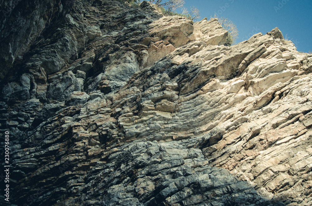 Rock, the background of the layers of ancient sediments.