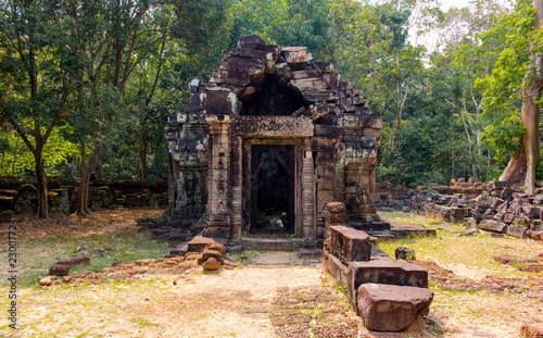 Ancient ruins of an abandoned temple of Prasat Krol Ko in the jungle at Angkor Wat complex, Siem Reap, Cambodia. Restored heritage of Khmer architecture in the modern world. UNESCO World Heritage site