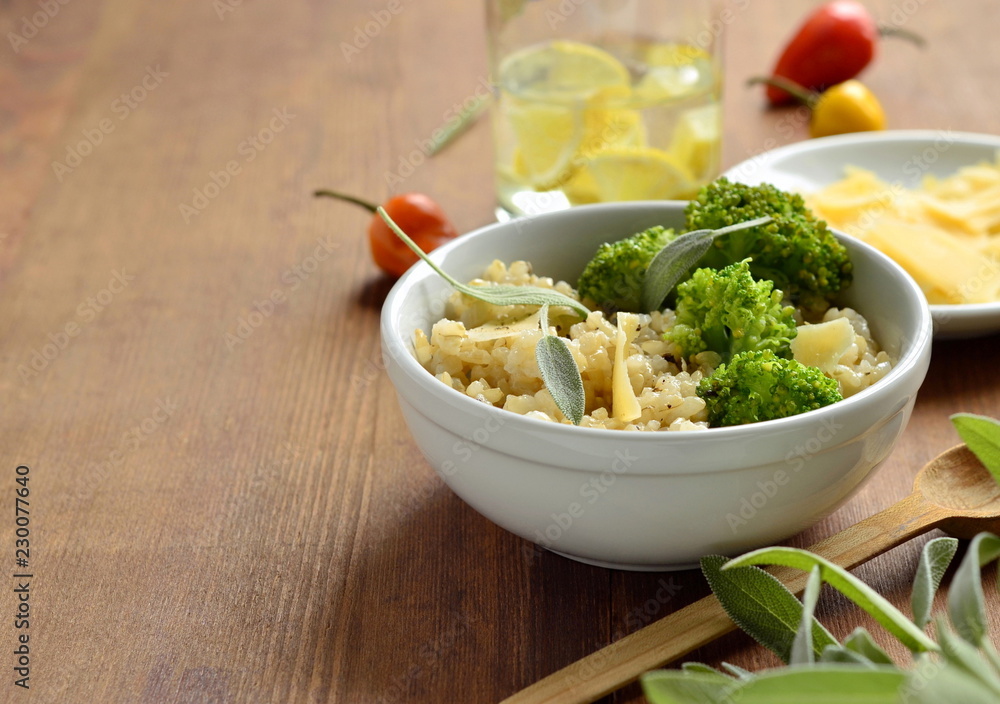 Brown rice with broccoli and parmesan cheese, copy space Brown rice with broccoli and parmesan cheese, copy space