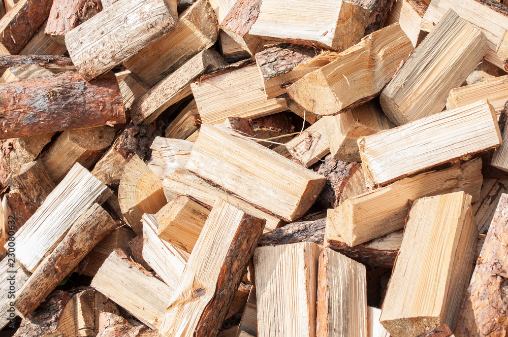A pile of firewood from birch on the lawn Texture to Chop wood A pile of firewood from birch on the lawn Texture to Chop wood