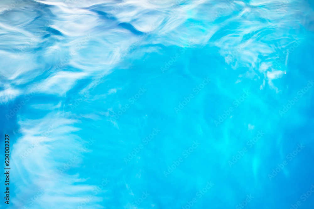 The smooth natural blue water background with bokeh abstract on the sea or ocean,vintage and soft colored blur. The smooth natural blue water background with bokeh abstract on the sea or ocean,vintage and soft colored blur.