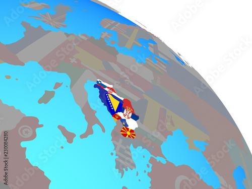 Former Yugoslavia with national flags on simple blue political globe. © harvepino