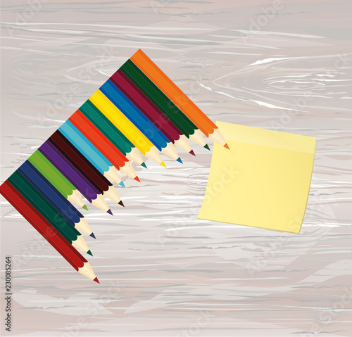 Colorful pencis. Yellow sheet of paper for notes. Sticker. Vector on wooden background. photo