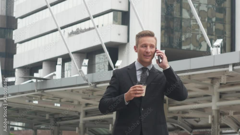 Business man take a coffee and using smart phone, Business concept.