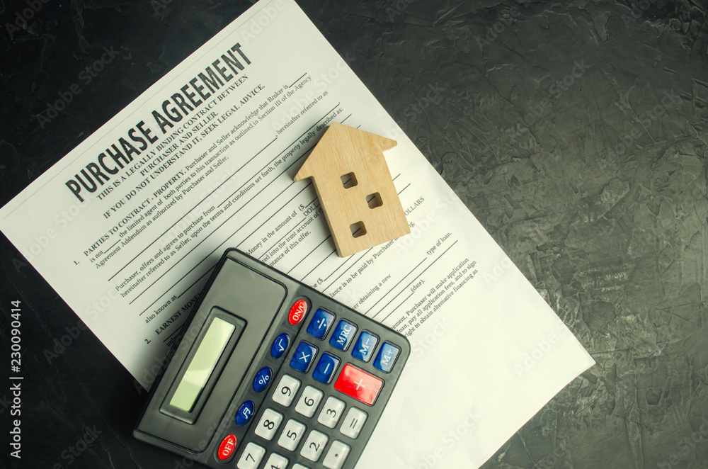 Purchase agreement. The concept of buying a home, real estate, apartment. Services realtor and real estate agent. Sale / sold house. selective focus Purchase agreement. The concept of buying a home, real estate, apartment. Services realtor and real estate agent. Sale / sold house. selective focus