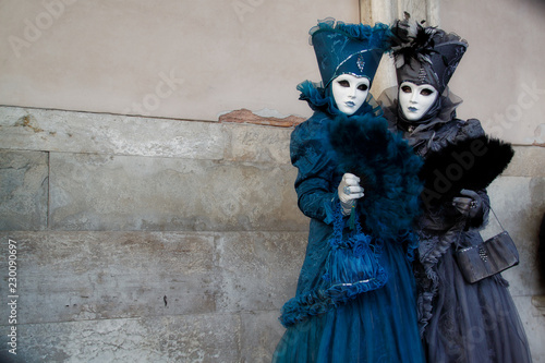 Colorful carnival blue-black mask and costume at the traditional festival in Venice, Italy