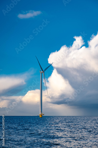 windmiil park in ocean, windmill farm rainy clouds photo