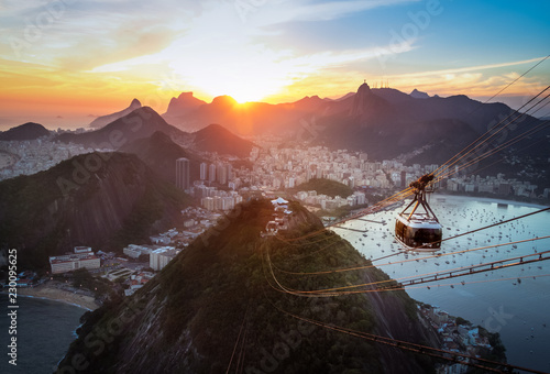 Aerial view of Rio de Janeiro at sunset with Urca and Sugar Loaf Cable Car and Corcovado mountain  - Rio de Janeiro, Brazil