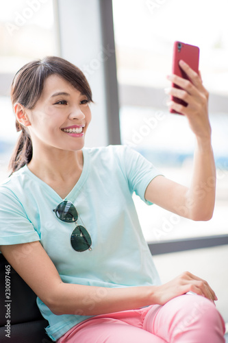 woman use phone selfie happily