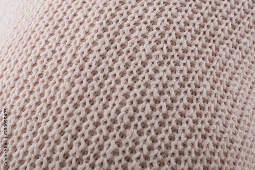 textile soft knitted closeup background pink and beige color textile soft knitted closeup background pink and beige color