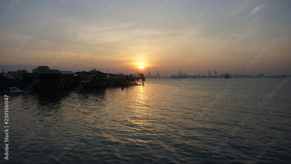 Beautiful silhouette during sunrise at Tan Jetty, George Town, Penang Beautiful silhouette during sunrise at Tan Jetty, George Town, Penang