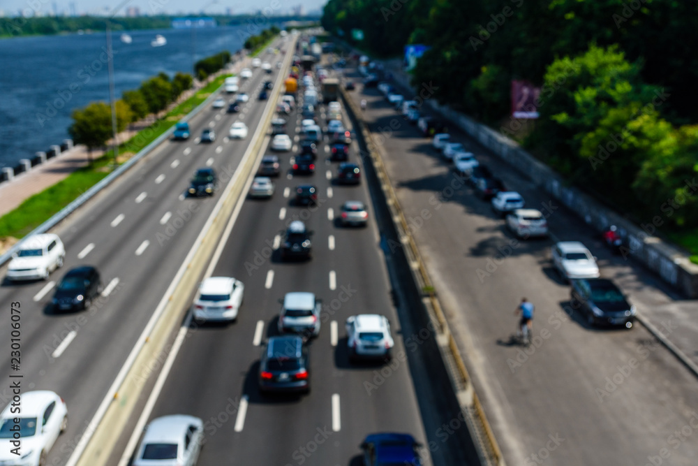 Abstract and blurred background of the many cars in street