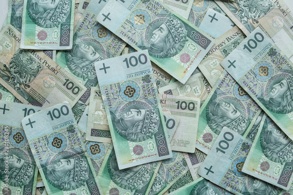The background full of 100 zloty- polish money. Business and finance.