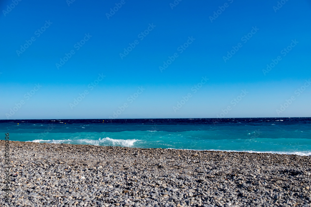 View from the beach in front of Nice on the surf in the Mediterranean on the French Riviera