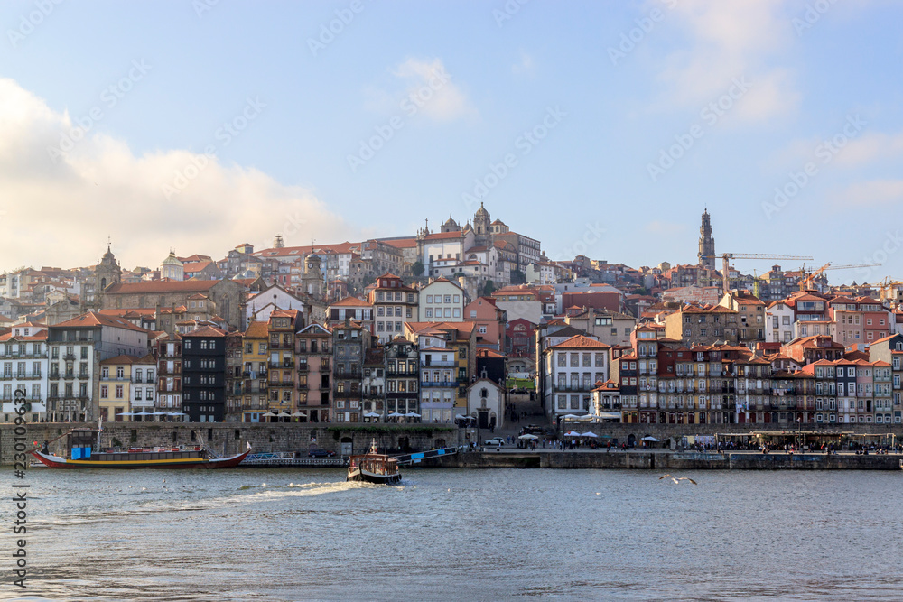 View of the Ribera from the opposite riverside  of the river Douro, Porto, Portugal. Colorful houses of old town on the embankment.