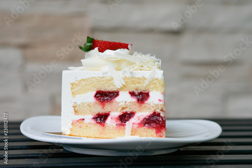 Strawberry short cake on white plate.