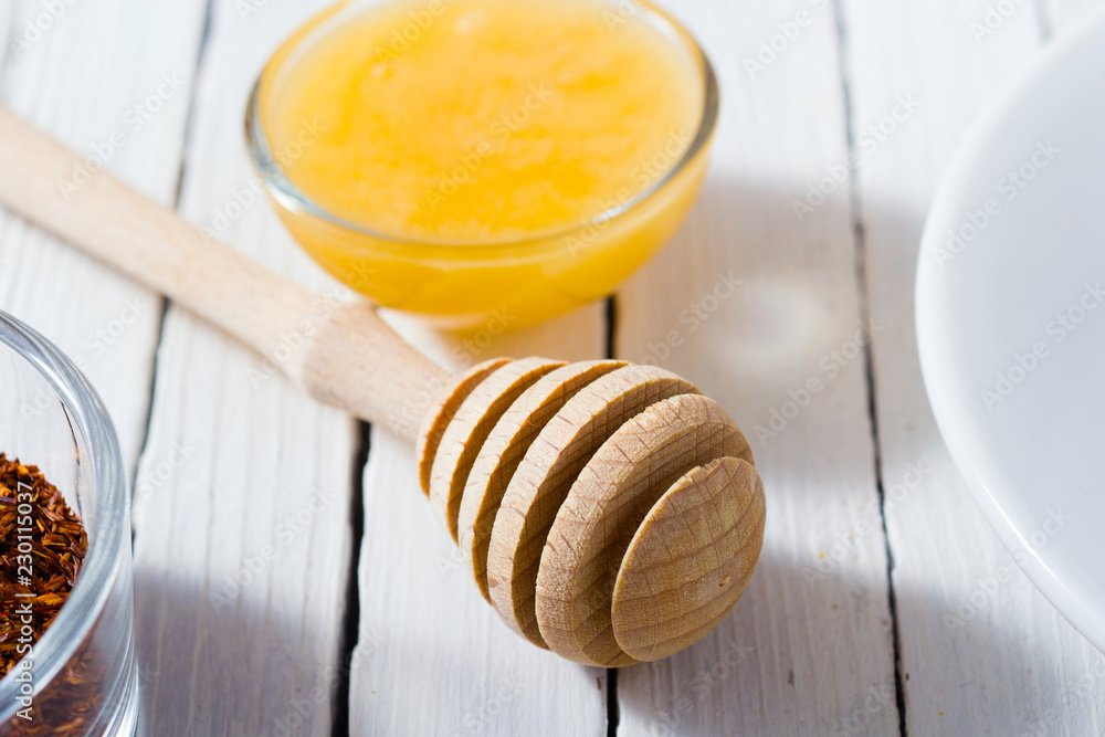 cup of tea, different leaves, honey, lemon ginger and brown sugar on white wooden table background cup of tea, different leaves, honey, lemon ginger and brown sugar on white wooden table background