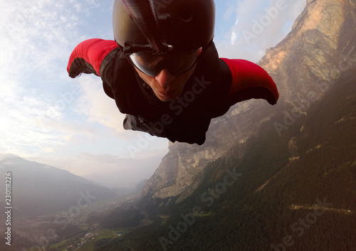 BASE Jumper Self Portrait. Wingsuit flight photo