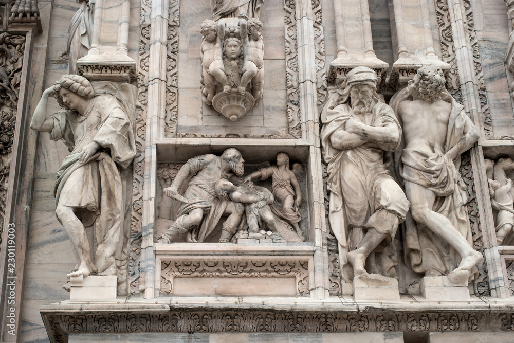 Architectural fragment of the Milan Duomo Cathedral. The cathedral was built in the Gothic and Romanesque styles. Milan, Italy, Lombardy