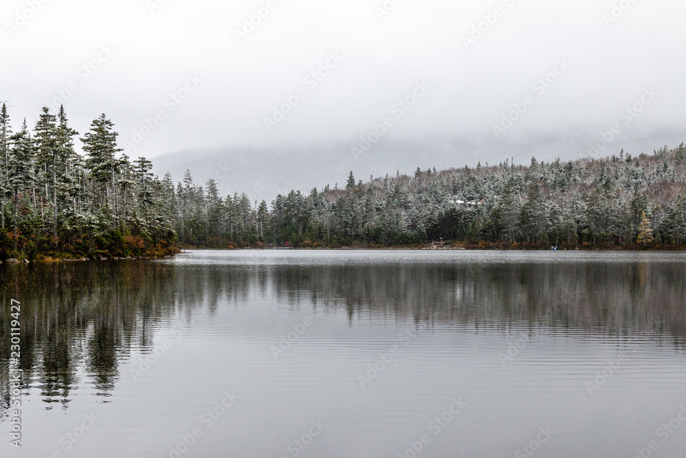 A frosty mountain lake high in the Adirondack Mountains.  - obrazy, fototapety, plakaty 