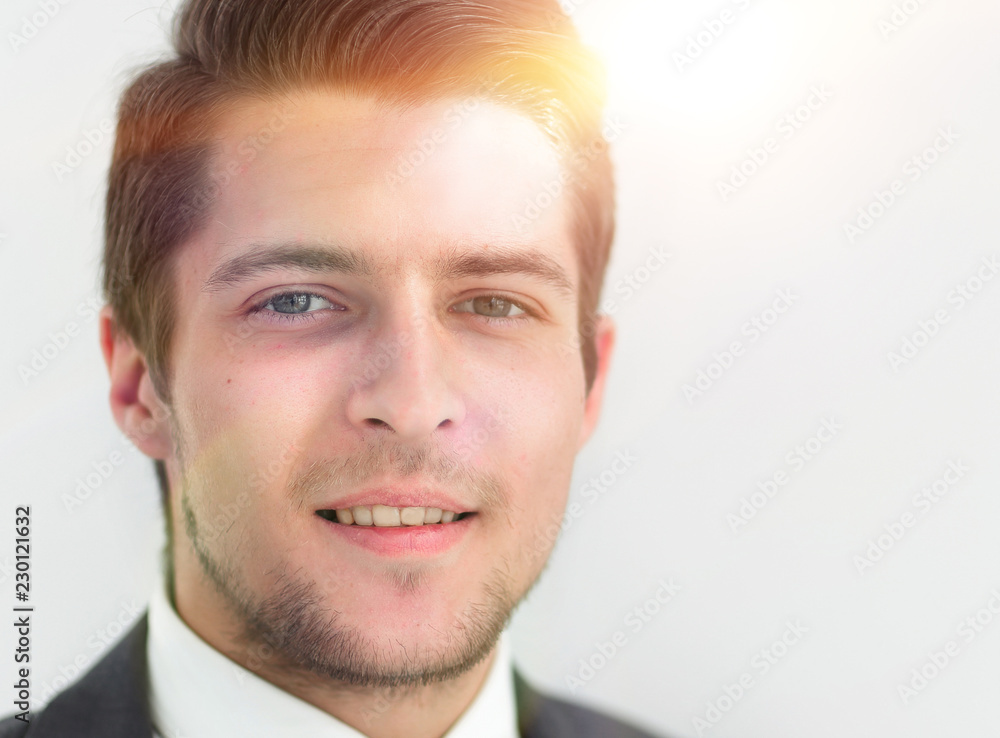 closeup.the face of a successful young man closeup.the face of a successful young man