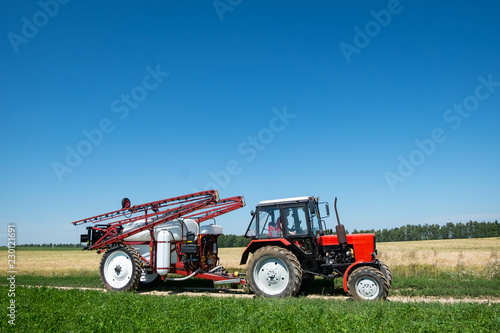 red tractor sprayer in the field