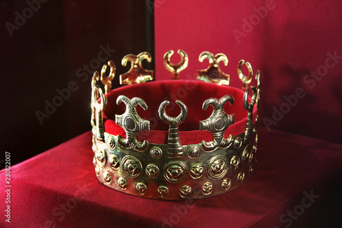 Golden crown on a red background