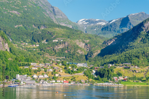 Fjord harbor with snow in the background
