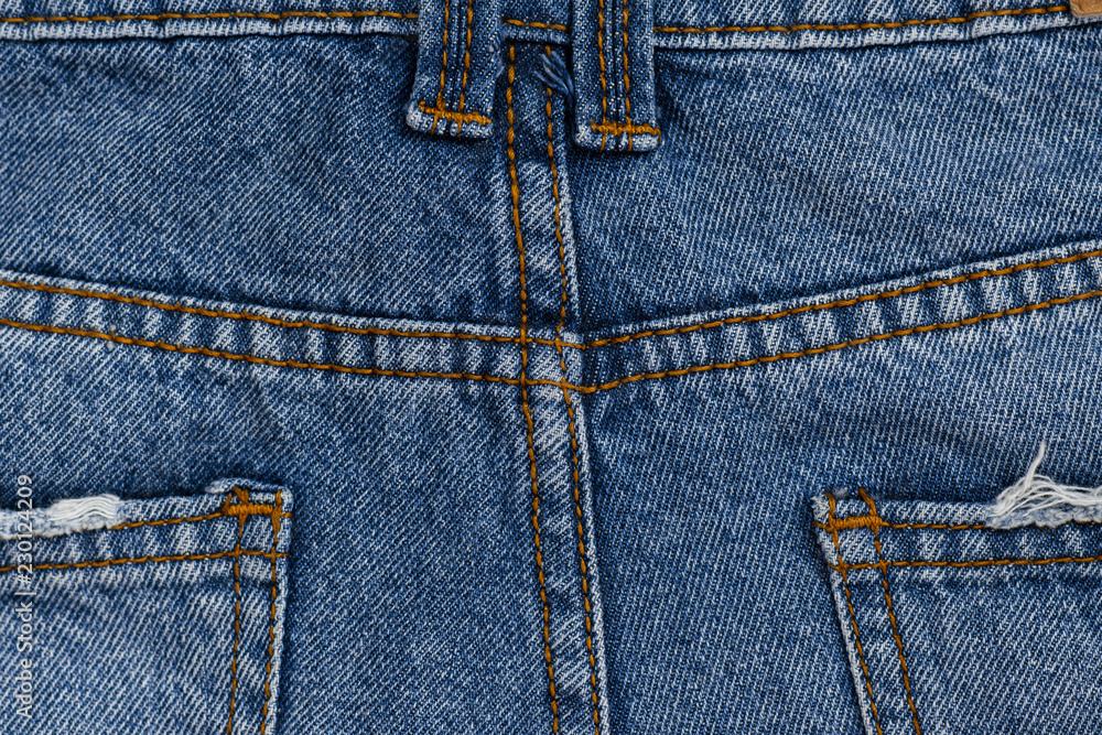 Closeup of blue Jeans detail. denim background.