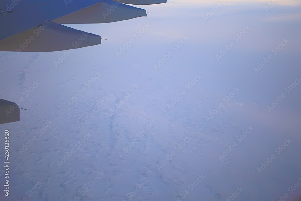 wing airplane view of sky / blue sky and wing of an airplane, view from the cabin of an airplane, concept of air transport wing airplane view of sky / blue sky and wing of an airplane, view from the cabin of an airplane, concept of air transport
