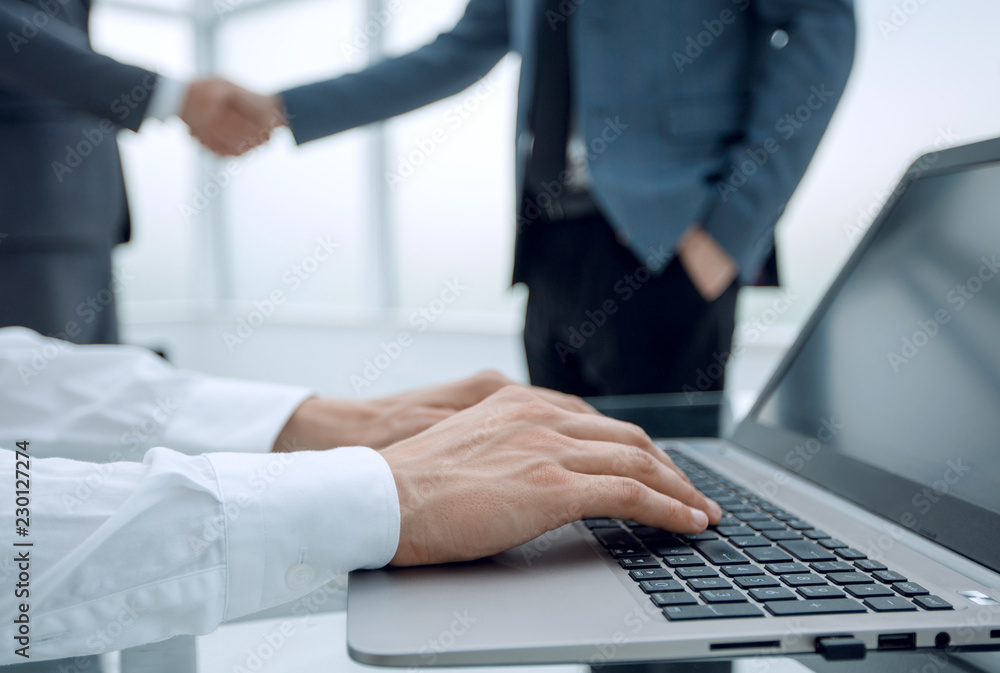 close up.businessman using laptop at workplace close up.businessman using laptop at workplace