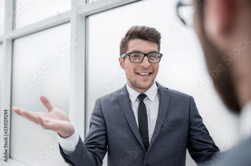young businessman talking standing in the office