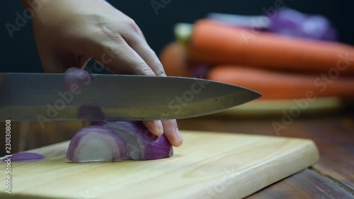 Shallot cut Shooting on the detail of the shallot cut. Cutting Shallots on Wooden Board. Slice the shallots.
